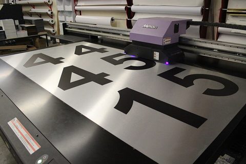 Large Format Printing of Black Numbers on a Brushed Aluminum Sheet.jpg
