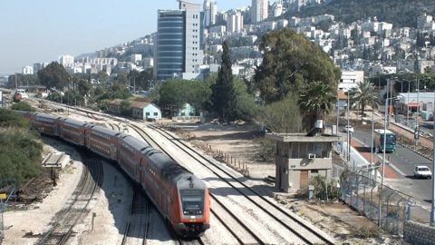 Bombardier Double-deck Coach moving westwards in Halisa, part of Haifas East Downtown, Israel April 2013.jpg