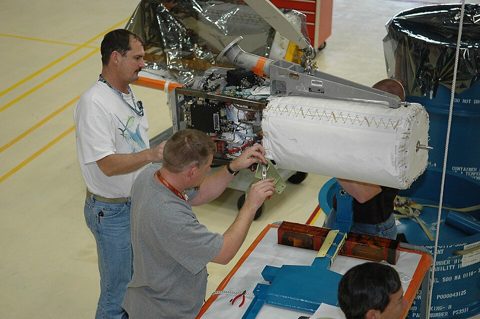 KSC-06pd0003 - Technicians working on fuel cell in OPF.jpg