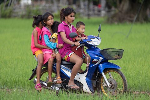 Five children on a motorcycle.jpg