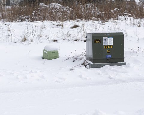 Pad-mounted electrical transformer and utility access cover.jpg