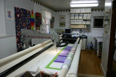 Longarm Quilting Machine with Quilt on frame.jpg