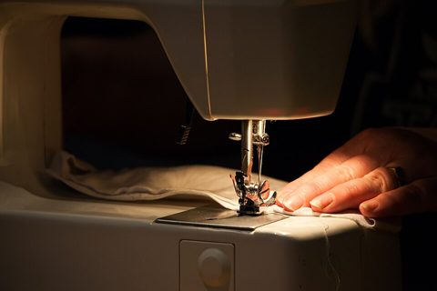 Woman sewing a face mask with a Singer machine 09.jpg