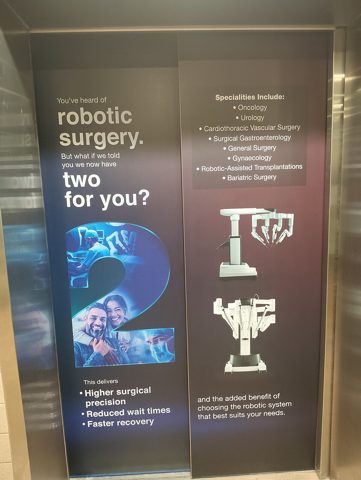 Robotic surgery ad at Manipal hospital lift door.jpg