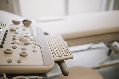 Ultrasound machine setup in a clean medical room.jpg