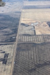 Drainage Tile Plow: Implement that pulls and lays perforated drain tile below a field