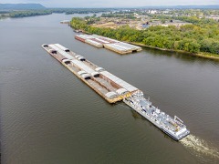 Hopper Barge: Open barge that dumps dredged spoil through bottom doors