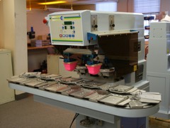 Pad Printing Machine: An indirect gravure press that lifts an inked image from an etched plate with a silicone pad