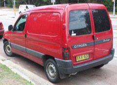Panel Van: Enclosed light commercial van with solid sides and no rear passenger windows