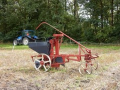 Potato Planter: Implement that meters and plants seed potatoes in ridged rows