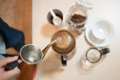 Pour-Over Coffee Dripper: Cone filter holder set over a mug or carafe for manual drip brewing
