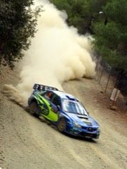 Rally Car: Modified production car prepared for high-speed off-road stage racing