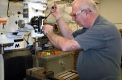 Turret Milling Machine: Versatile vertical mill with a quill and swiveling turret head for tool-shop work