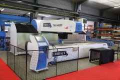 Waterjet Cutter: An abrasive waterjet cutting machine: a 4000+ bar intensifier pump drives a sapphire orifice and abrasive